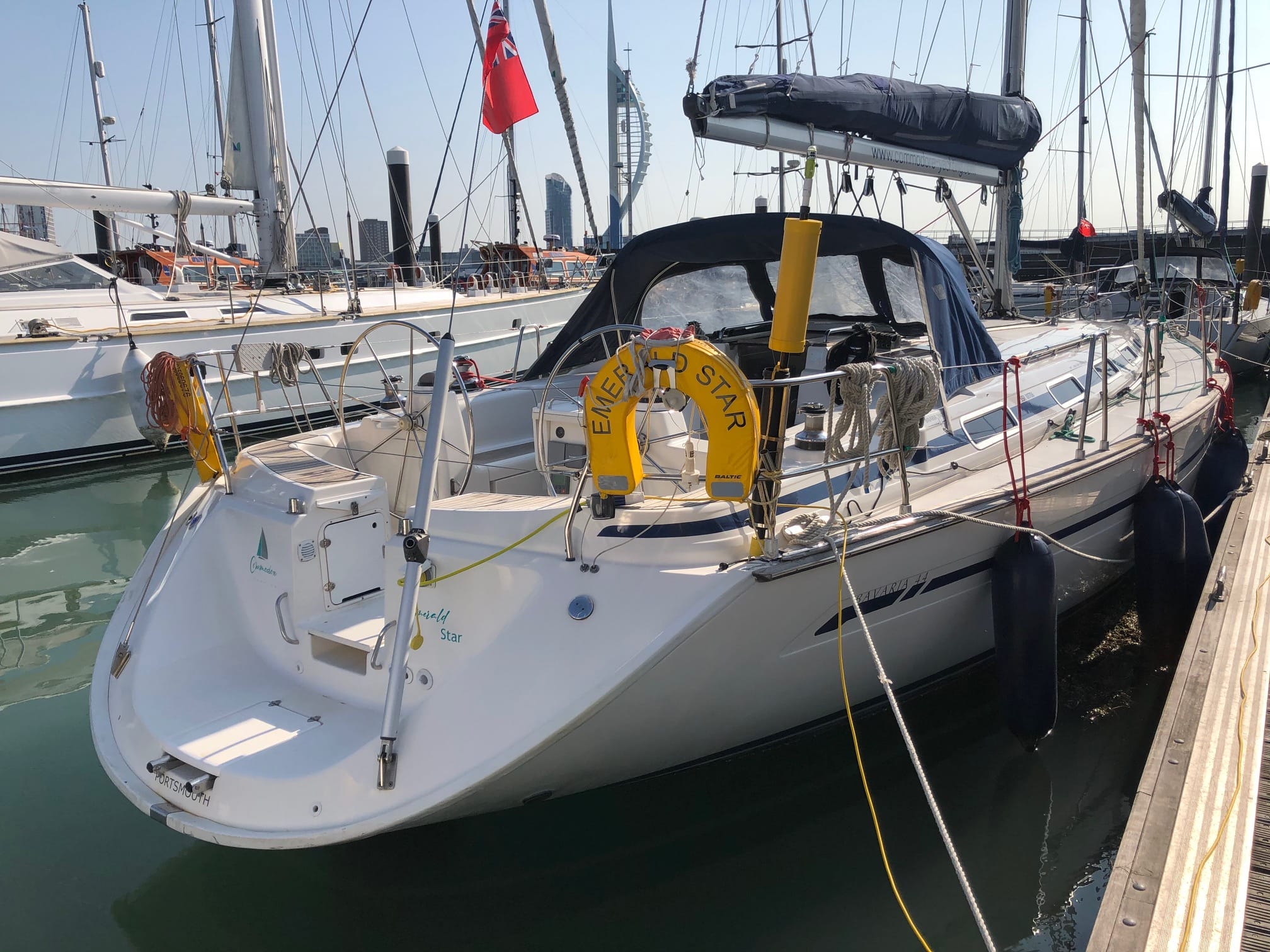 Christmas gift guide for sailors — sailboat Emerald Star docked at marina with Spinnaker Tower backdrop
