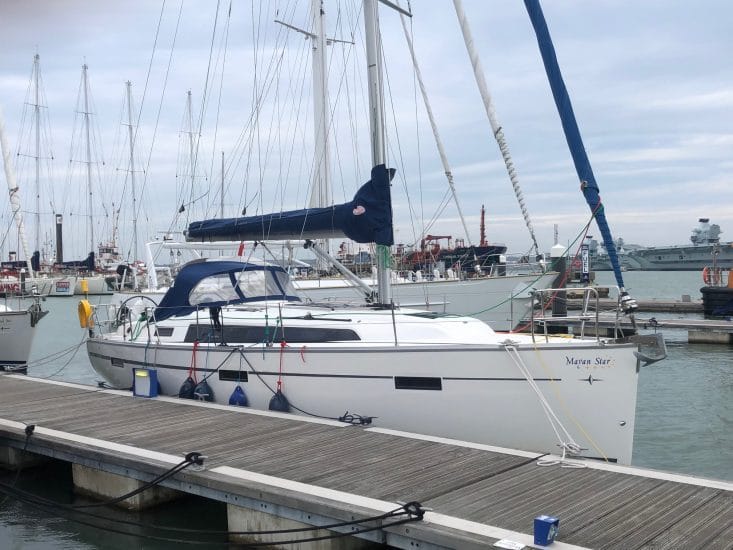 online vs classroom RYA theory — marina with several sailboats docked alongside each other