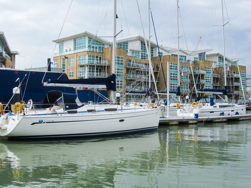 online vs classroom RYA theory — modern waterfront apartments overlooking sailboats