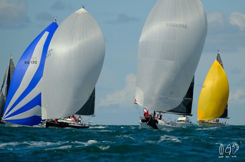 RYA Day Skipper vs Yachtmaster — sailboats with colorful spinnakers racing on open water